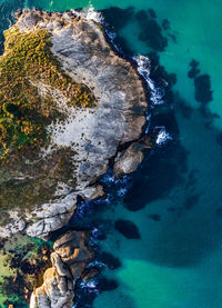 High angle view of rock formation in sea