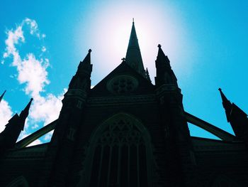 Low angle view of church against blue sky