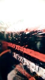 Close-up of wet car window during rainy season