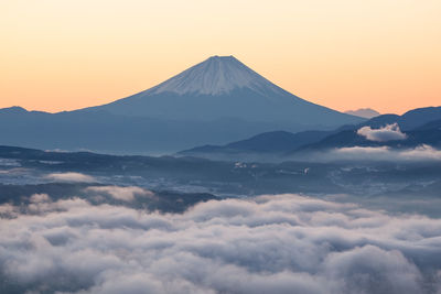 Scenic view of mountains against sky during sunset