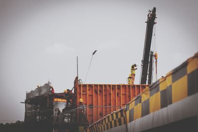 Low angle view of construction site against sky