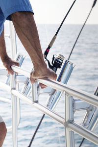 Cropped image of senior man in boat on sea