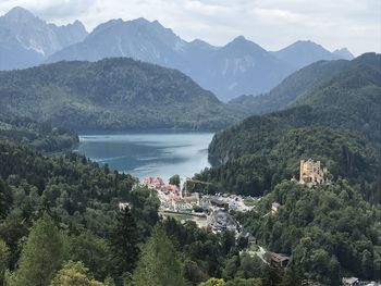 High angle view of townscape by mountains