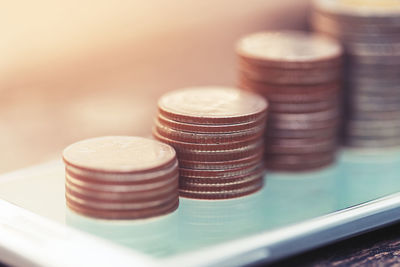 Close-up of coins on table