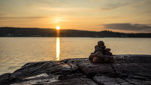 Scenic view of lake against sky during sunset