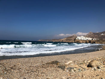 Scenic view of beach against clear sky