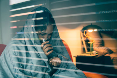 Reflection of people on glass window