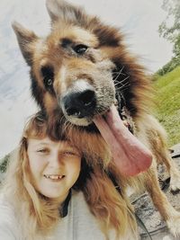 Portrait of smiling woman with dog