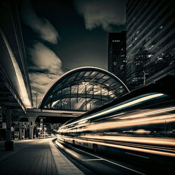 Illuminated bridge against sky at night