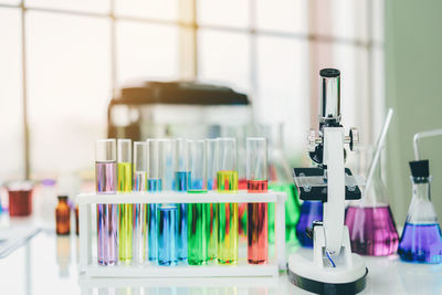 Close-up of chemicals on desk in laboratory