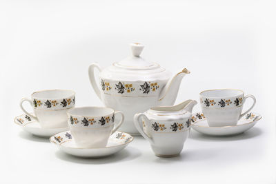 Close-up of tea cup against white background