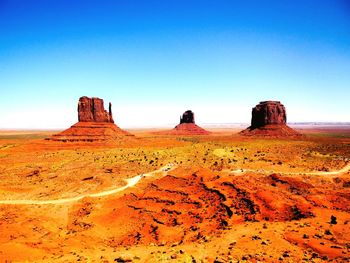 Scenic view of mountain against blue sky