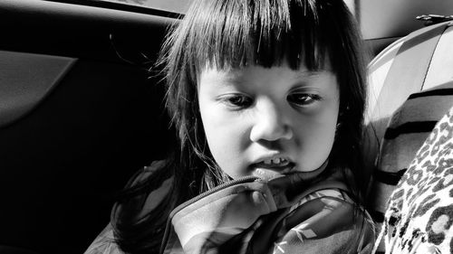 Close-up of girl sitting in car