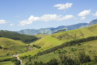 Scenic view of landscape and mountains against sky