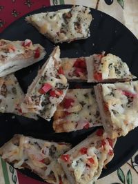 High angle view of pizza in plate on table