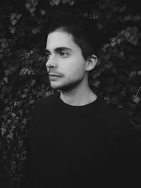 Portrait of young man looking away