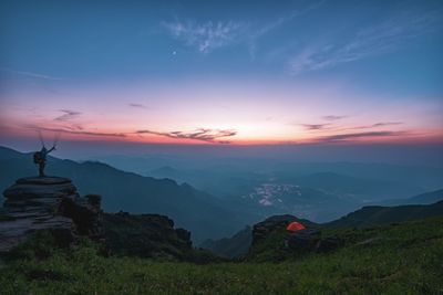 Scenic view of mountains against sky during sunset