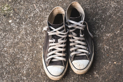 High angle view of shoes on concrete