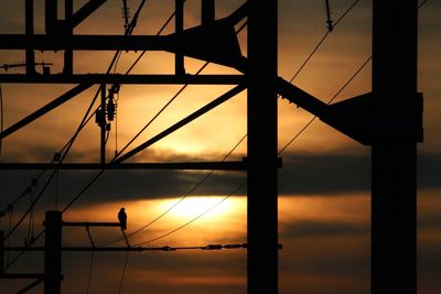 Low angle view of electricity pylon against sky