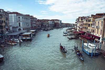 High angle view of canal amidst buildings in city