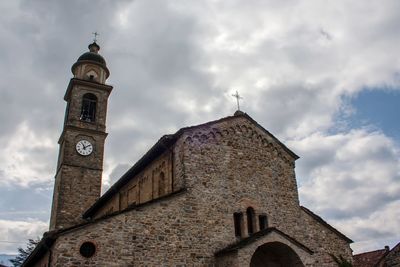 Low angle view of clock tower against sky