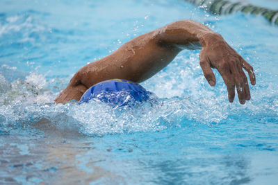 Man swimming in pool