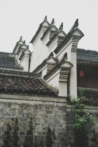 Low angle view of old building against clear sky