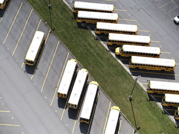 Usa, virginia, leesburg, aerial view of school buses in parking lot