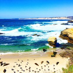 Scenic view of sea against clear blue sky