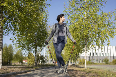 Full length of man standing against trees