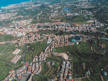 High angle view of trees and buildings in city