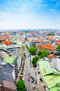 High angle view of buildings in city against sky