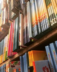 High angle view of books in shelf