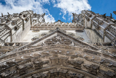 Low angle view of ornate building against sky