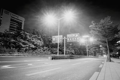 View of basketball by street at night