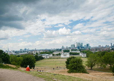 Scenic view of trees and buildings against sky