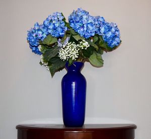 Close-up of flower vase against white background