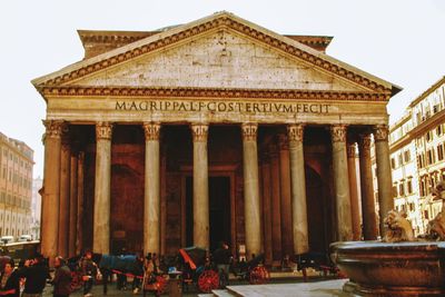 Group of people in front of historical building