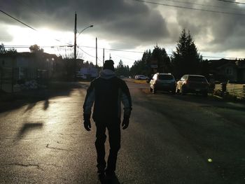 City street against cloudy sky