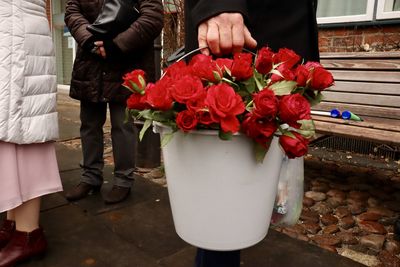 A bucket full of red roses