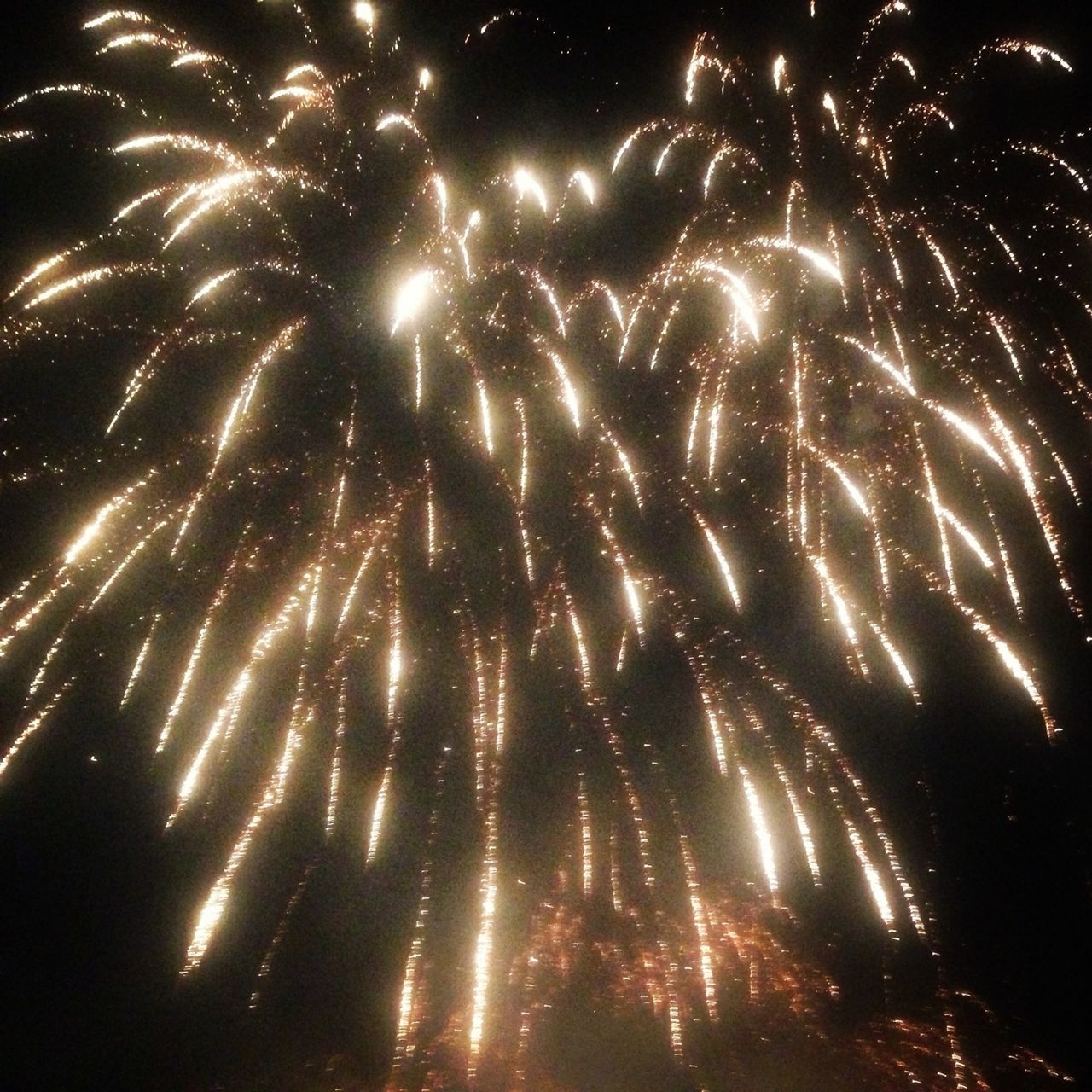 night, illuminated, long exposure, firework display, low angle view, glowing, motion, celebration, exploding, firework - man made object, sparks, arts culture and entertainment, sky, firework, blurred motion, event, outdoors, no people, entertainment, awe