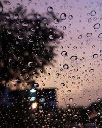 Full frame shot of raindrops on glass window