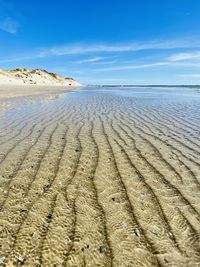 Surface level of beach against sky