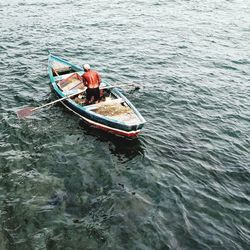 High angle view of fishing boat sailing in sea