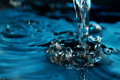 Close-up of drop splashing in water