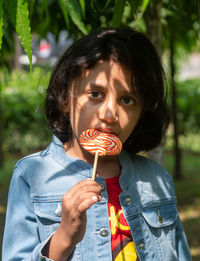 Portrait of boy holding ice cream