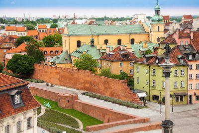 High angle view of old town against buildings in city