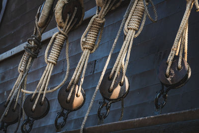 Close-up of sailboats tied on rope