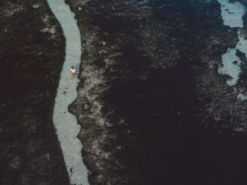 Woman wading in sea