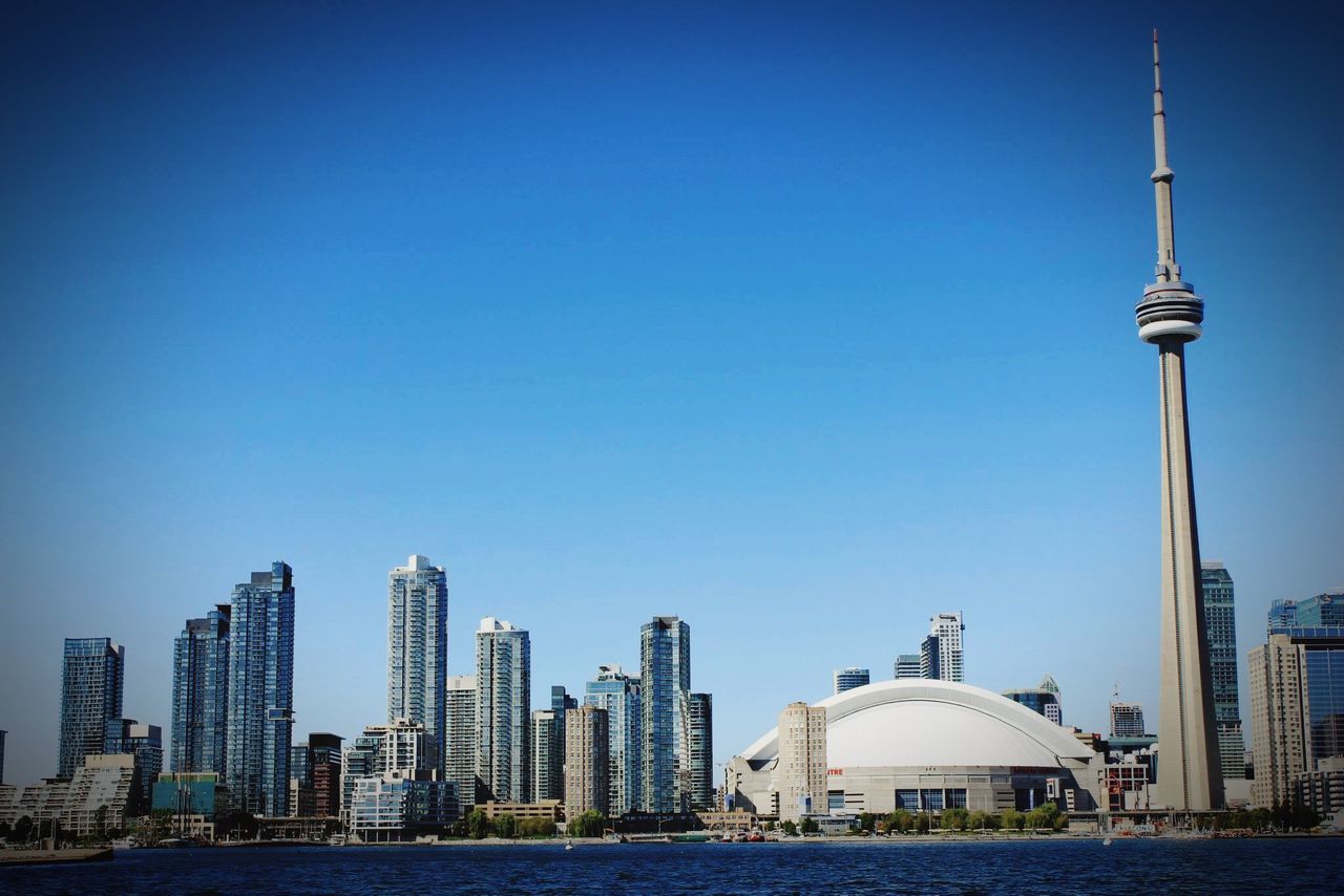 tower, blue, architecture, city, urban skyline, travel, travel destinations, clear sky, skyscraper, building exterior, built structure, tourism, sky, outdoors, place of worship, dome, cityscape, no people, day